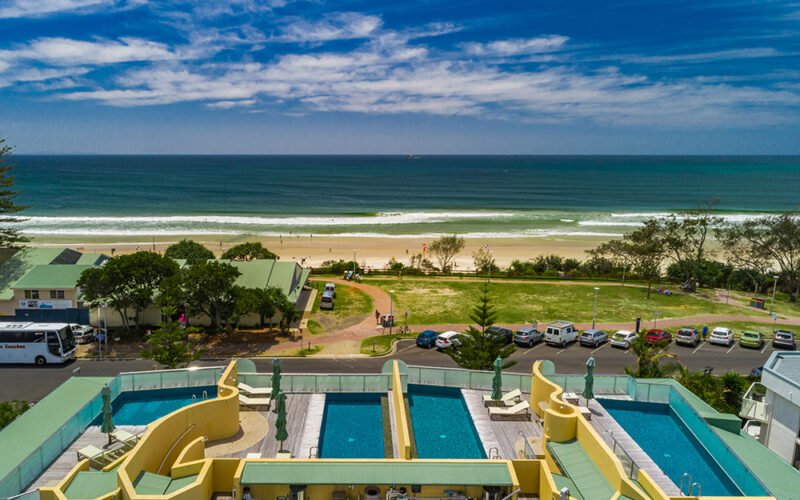 Aerial view over Beach Suites toward Byron Bay's Main Beach