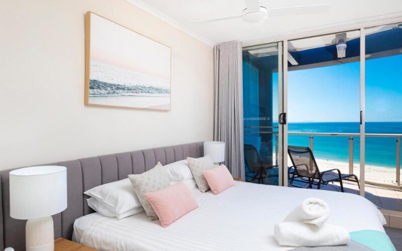 Ocean-view bedroom at Beaches International, Forster