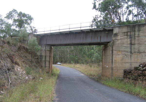 The Bylong Valley Way passing under the rail bridge between the Hunter and Mudgee, NSW