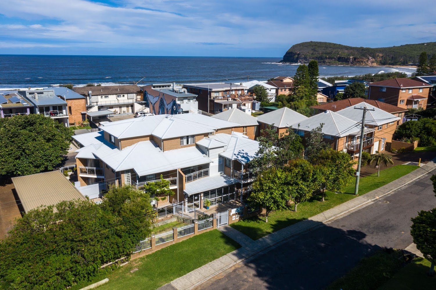 copacabana-shores-aerial-beach - AustralianSecret Aerial view of Copacabana Shores motel beside Copacabana Beach, NSW Central Coast