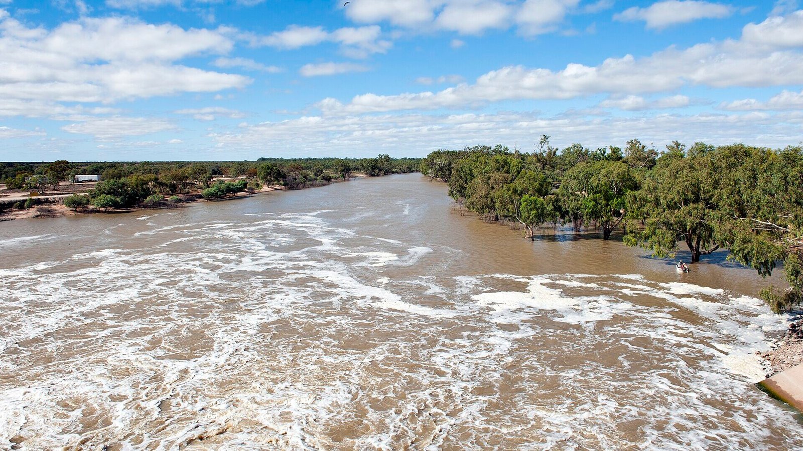 The Darling River flowing past the Main Weir at Menindee Lakes, outback NSW