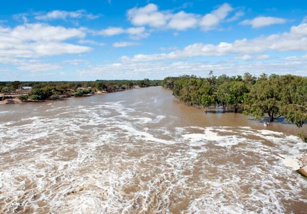 The Darling River flowing past the Main Weir at Menindee Lakes, outback NSW