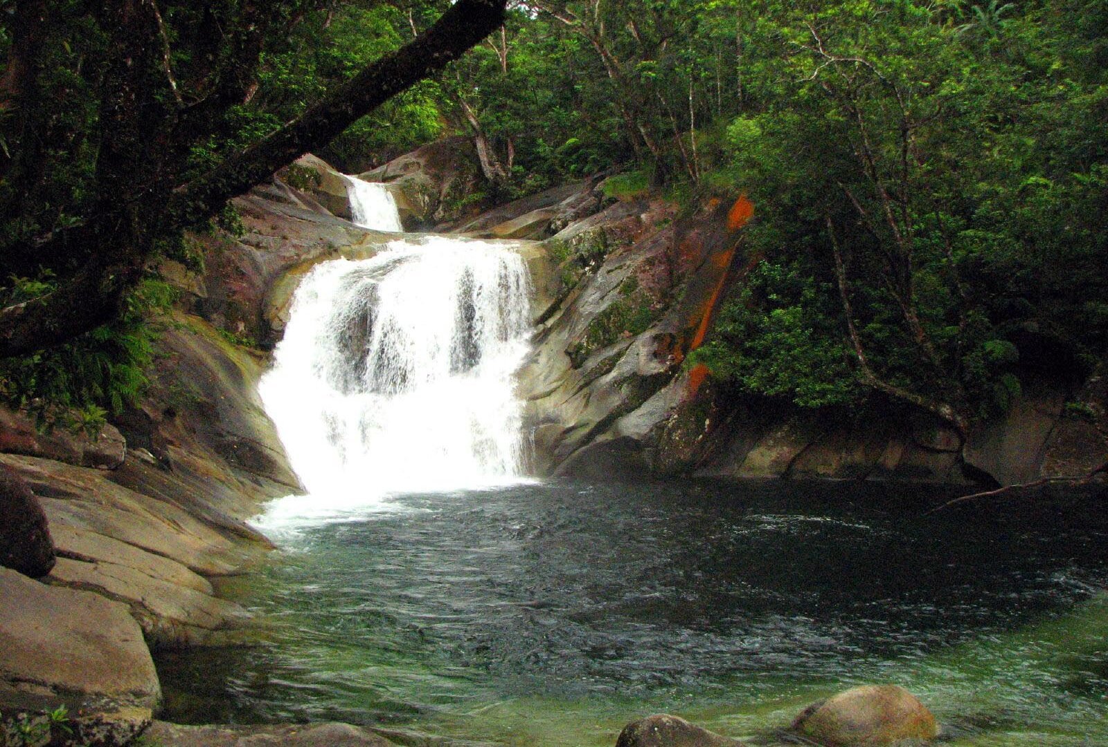 The cascades and swimming pool at Josephine Falls in rainforest, Far North Queensland