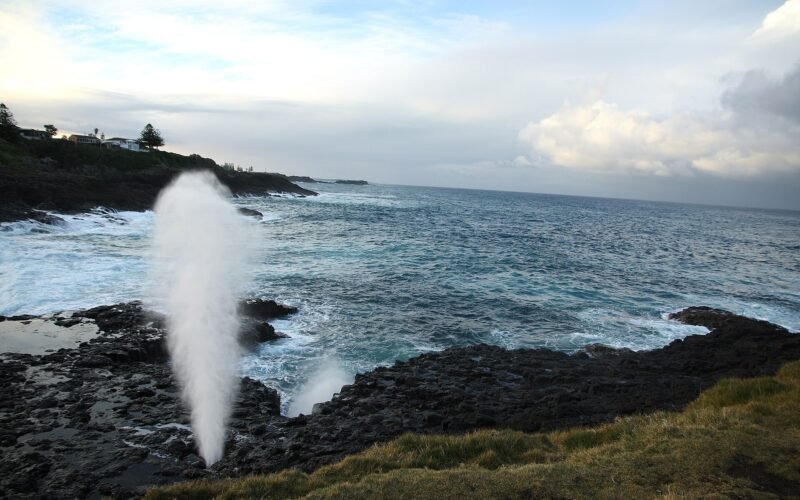 Spray bursting from the Little Blowhole at Kiama on a big swell