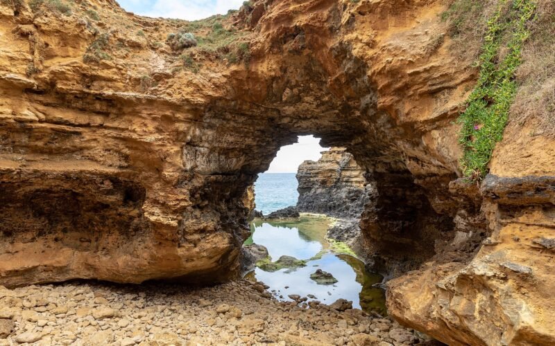 Looking through The Grotto arch to the still pool and Southern Ocean, VIC