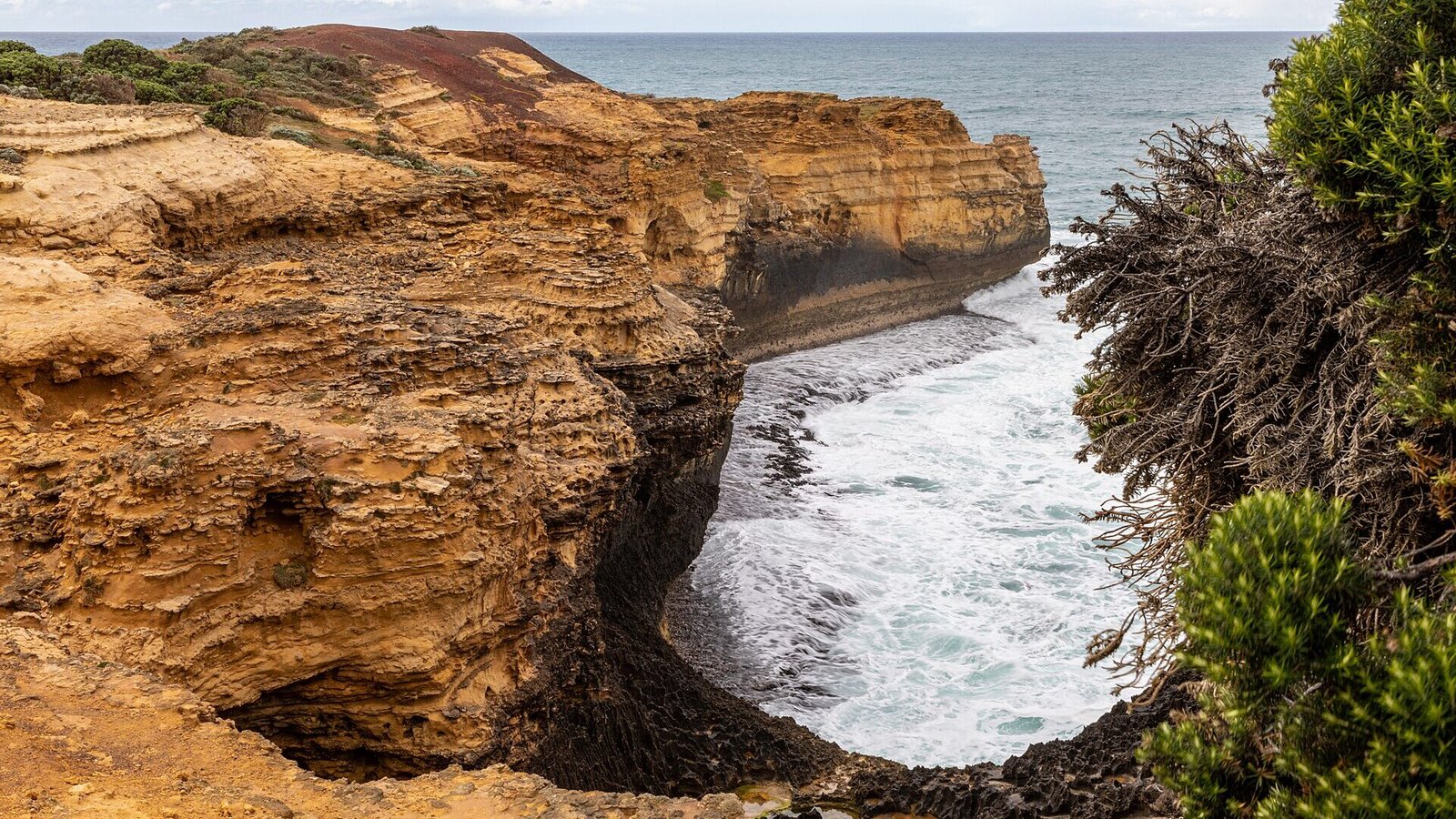 The Grotto rock arch framing the ocean pool, Port Campbell National Park VIC