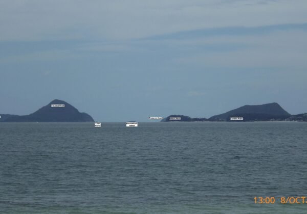 Tomaree Head rising over the entrance to Port Stephens, seen from Salamander Bay