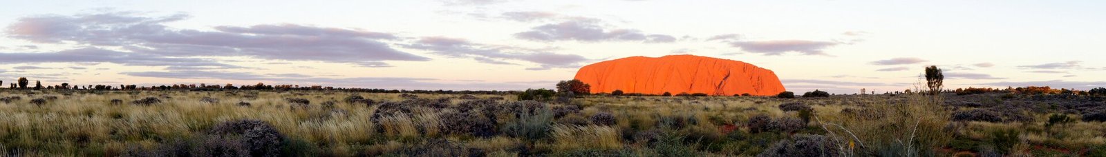 Uluru glowing red at sunset in the Red Centre